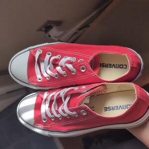 Red low top converse shoes